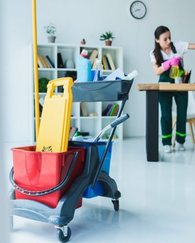 young-female-janitor-cleaning-office-with-various-cleaning-equipment.jpg young-female-janitor-cleaning-office-with-various-cleaning-equipment.jpg